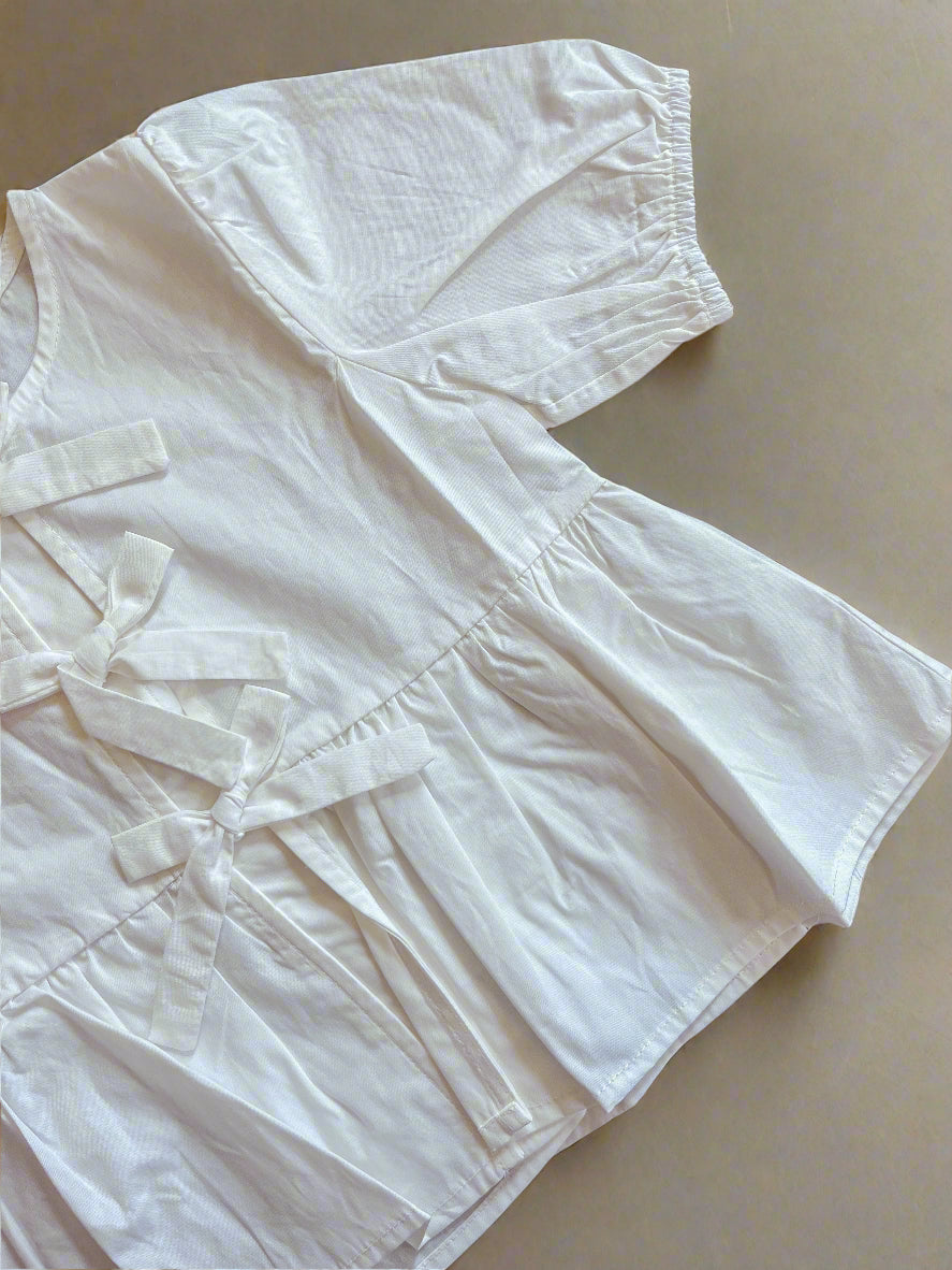 PRETTY IN PEPLUM TOP